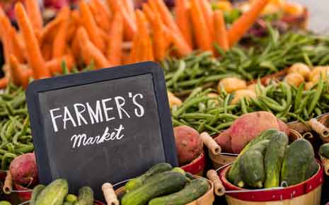 image of a farmer's market sign with produce