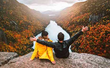 A couple taking in the view in the Adirondack Mountains