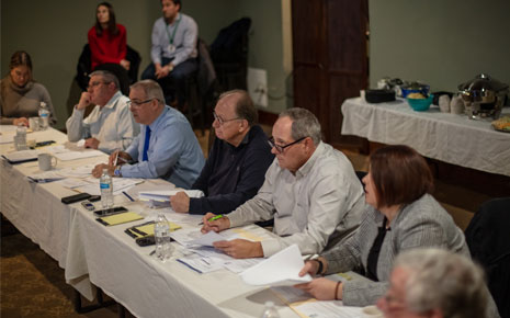Boards members of the Clinton County Industrial Development Agency (CCIDA) discussing agenda items at a meeting